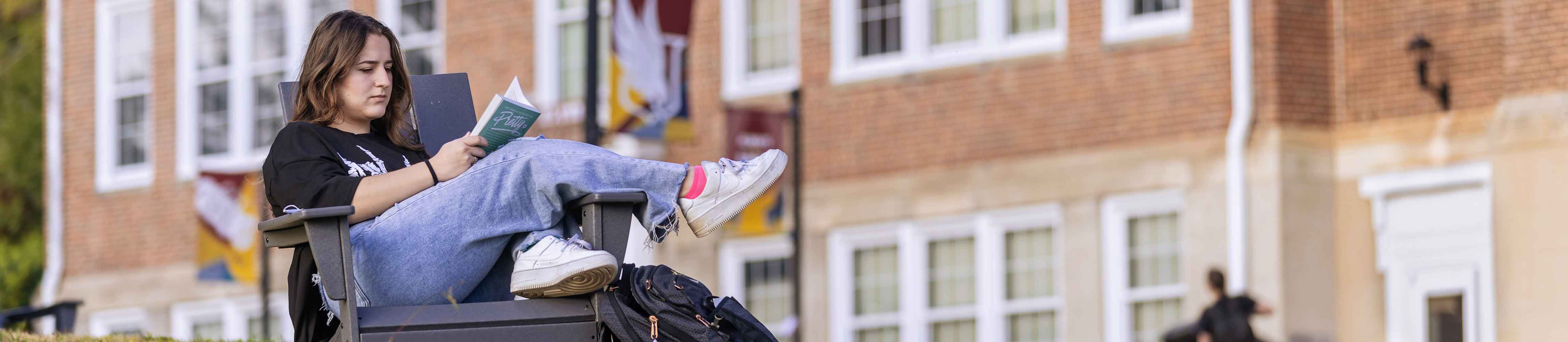student reading outside