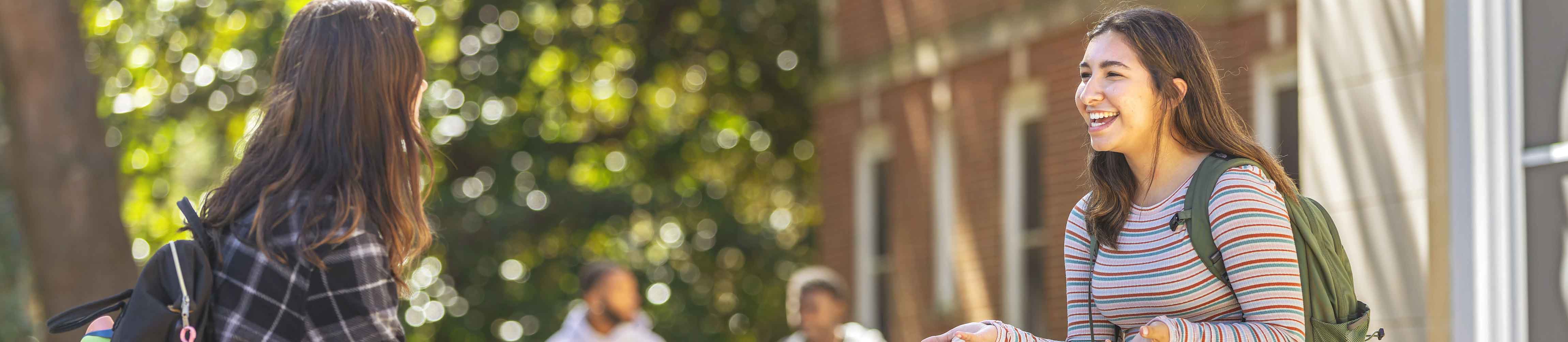 students talking outside