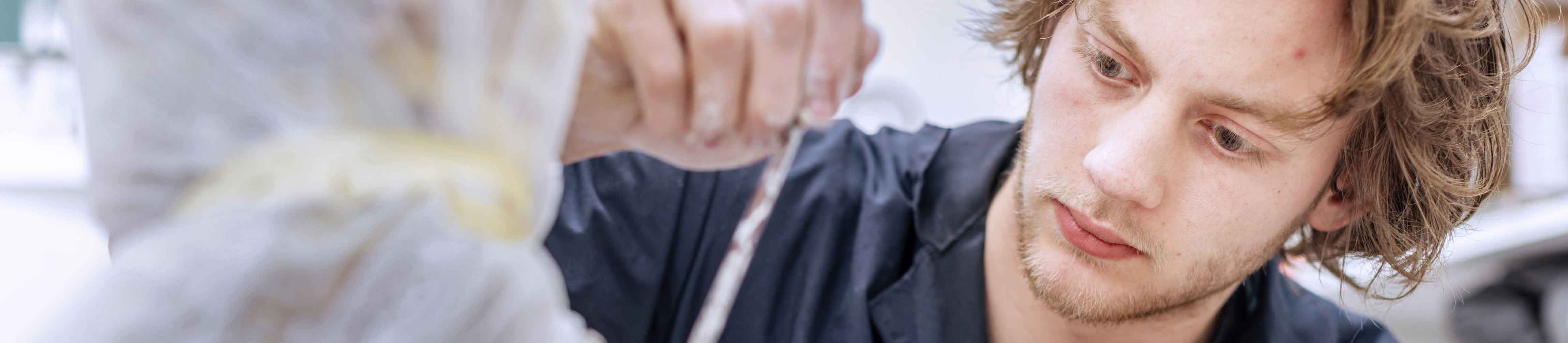 student working on an art project