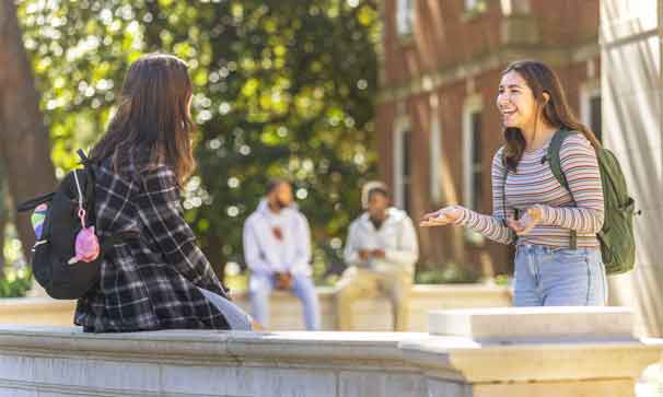 students talking outside