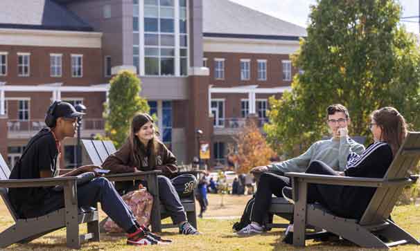 students sitting outside