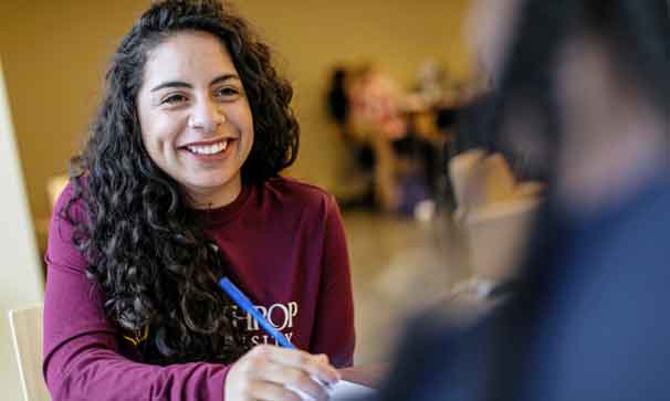 student smiling in a class