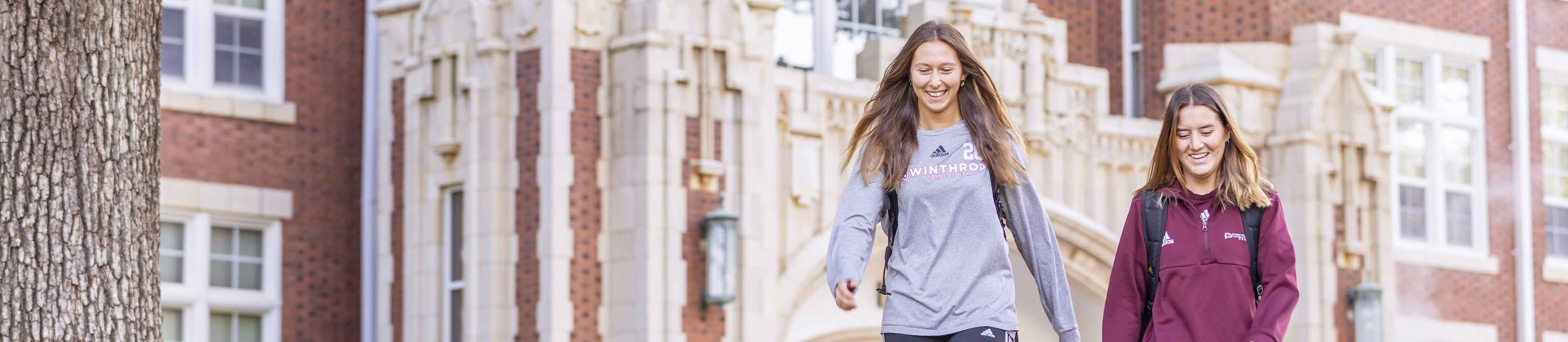 students walking outside on campus