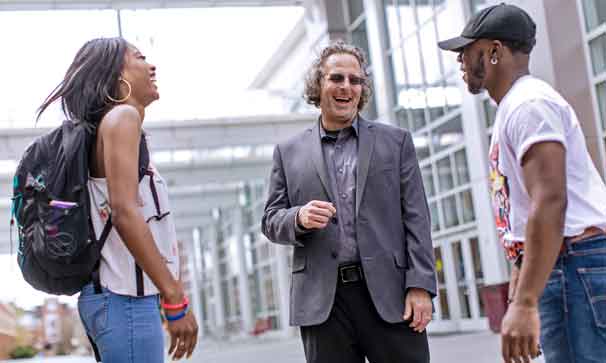 faculty member with two students